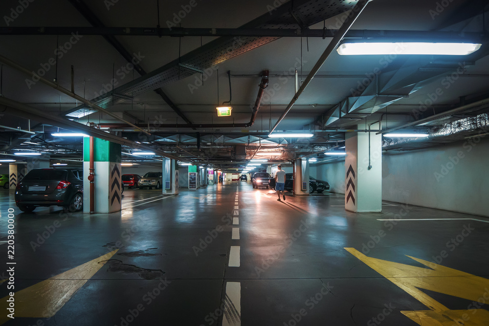 Underground garage or modern car parking with lots of vehicles