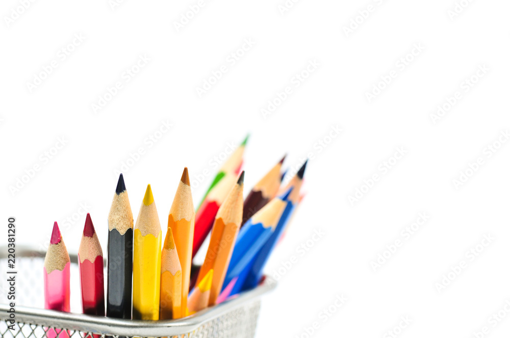 Colored pencils in pencil case isolated on white background.
Colored pencils in pencil case isolated on white background.