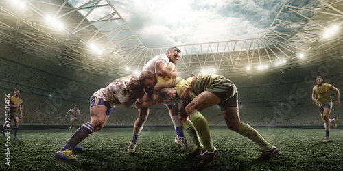 Foto Rugby players fight for the ball on professional rugby stadium