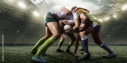 Canvas Print Rugby players fight for the ball on professional rugby stadium