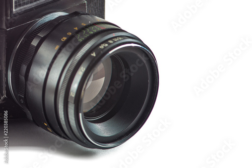dark camera lens with diaphragm blades on white background