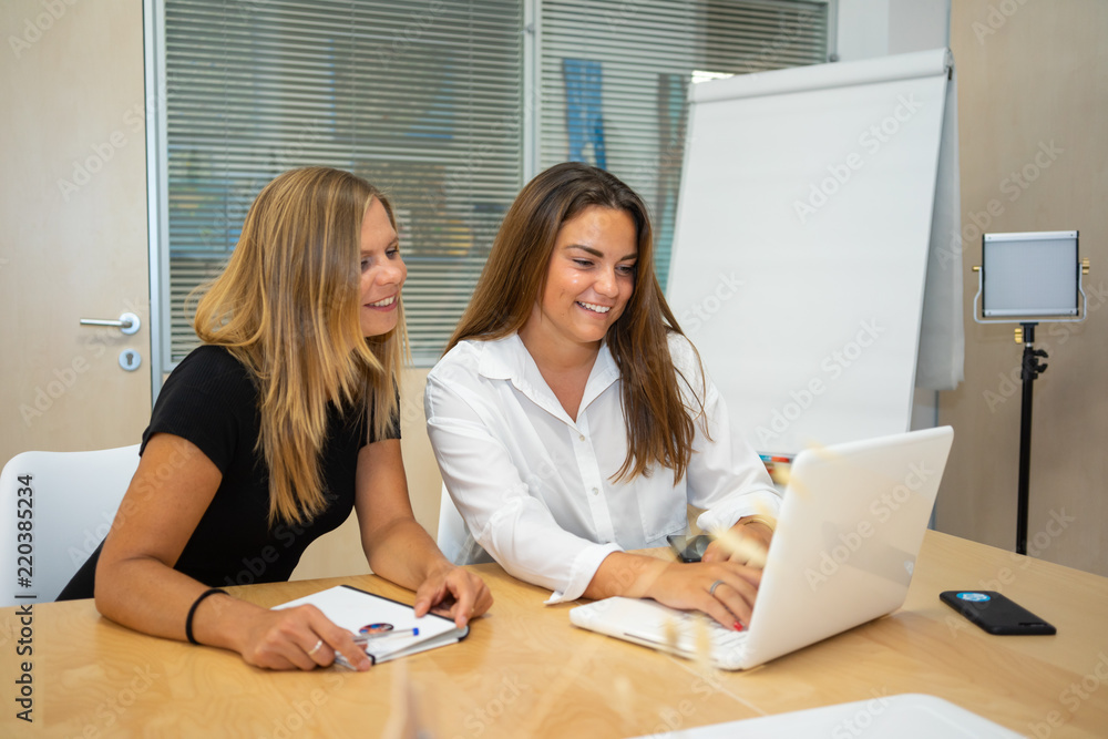 team of women preparing their business idea, meeting of female team in coworking. Blank screens for photomontage team of women preparing their business idea, meeting of female team in coworking. Blank screens for photomontage