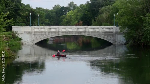 A kayaker takes advantage of the rising Yahara River to get close to a bridge ahead of flooding in Madison, WI. photo