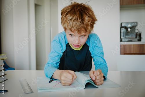 little boy hates doing homework, stress and agreession