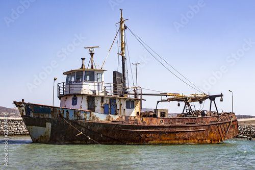 Old rusty ship in the harbor. Ghost boat © Victor