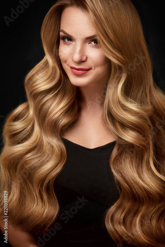 Beauty Hair. Beautiful Woman With Curly Long Blond Hair