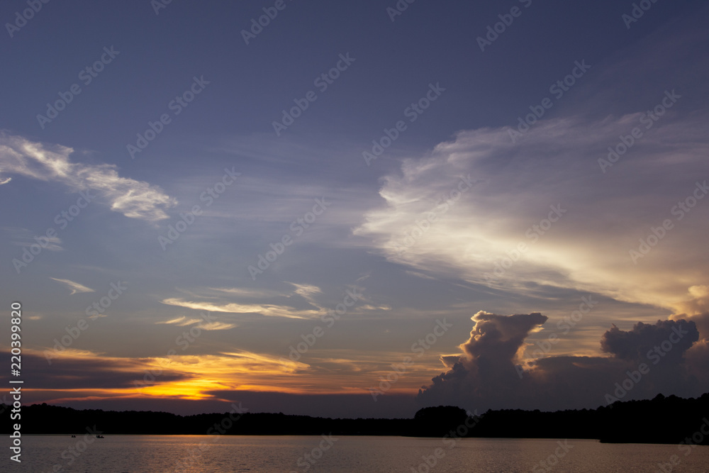 Warm Clouds Above a Lake at Sunset