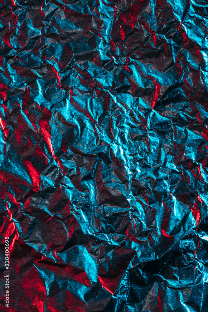 beautiful shiny abstract crumpled blue foil background