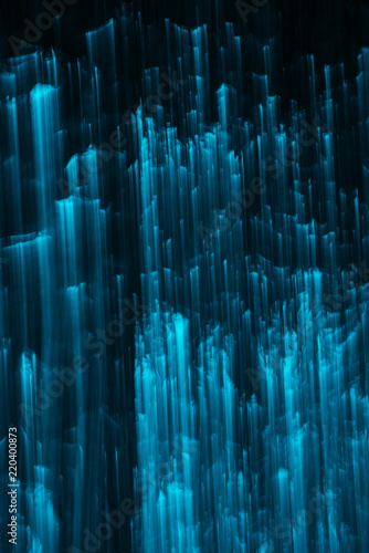 abstract glittering blue lights on black background