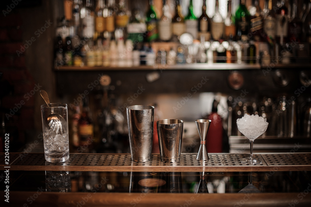 Set of necesary barman equipment on the bar counter Set of necesary barman equipment on the bar counter