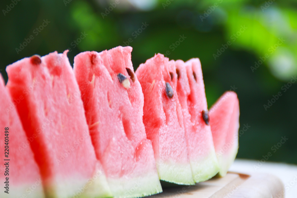 Flat lay composition of watermelon on wooden board. Flat lay composition of watermelon on wooden board.
