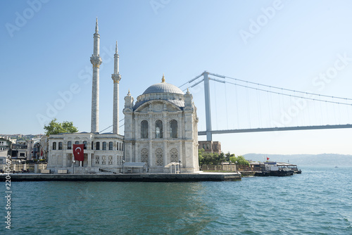 Ortakoy mosque and July 15 Martyrs' Bridge formerly known as Bosphorus Bridge, Istanbul, Turkey. 