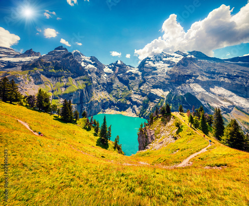 Colorful summer morning on the unique Oeschinensee Lake.