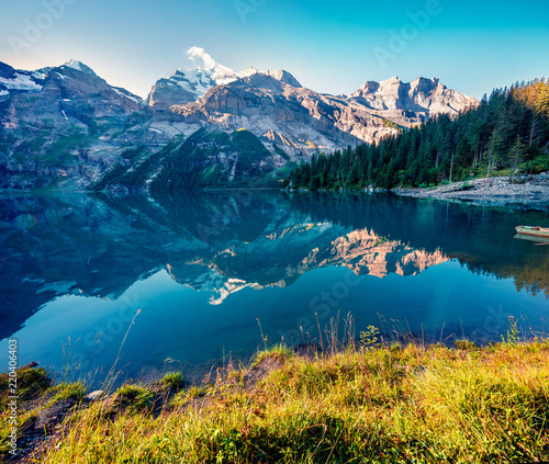 Colorful summer sunrise on the unique Oeschinensee Lake.