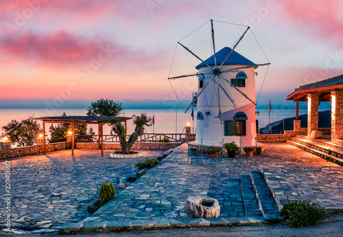Fabulous morning scene on the Windmill. Colorful spring sunrise on the Zakynthos island, Korithi location, Ionian Sea, Greece, Europe. Beauty of countryside concept background.