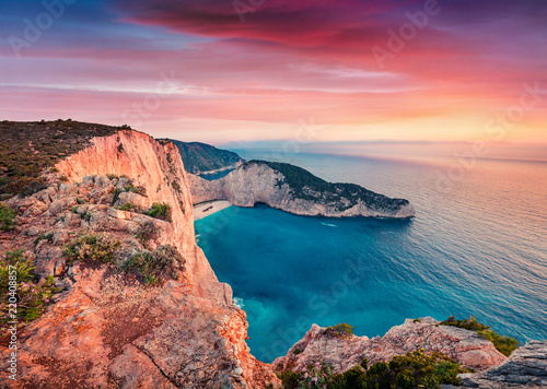 Dramatic spring scene on the Shipwreck Beach. Colorful sunset on the Ionian Sea, Zakinthos island, Greece, Europe. Beauty of nature concept background. Artistic style post processed photo. photo