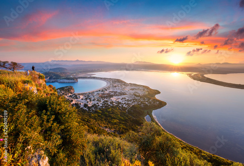 Fototapeta Naklejka Na Ścianę i Meble -  Colorful spring view of the Voidokilia beach from Navarino Castle. Great sunrise on the Ionian Sea, Pylos town location, Peloponnese, Greece, Europe. Beauty of nature concept background.