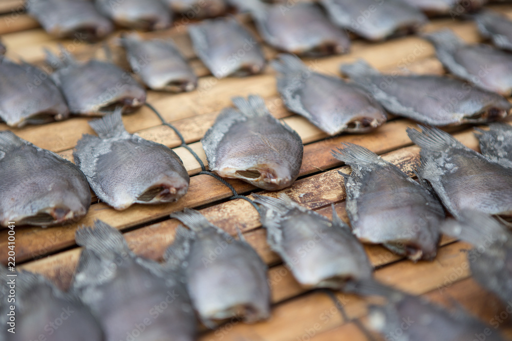Close up Dried fish on bamboo mat Close up Dried fish on bamboo mat