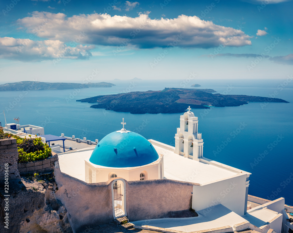 Sunny morning view of Santorini island. Picturesque spring scene of the  famous Greek resort - Fira, Greece, Europe. Traveling concept background.