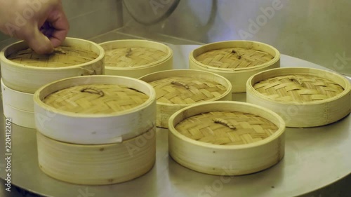 Wooden baskets containing Chinese Dim Sum steaming, ready to serve. photo