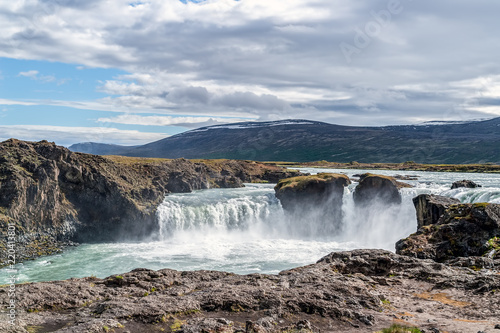 Godafoss waterfall  or waterfall of the gods - Northern Iceland. The water of the river Skjalfandafljot falls from a height of 12 meters over a width of 30 meters.