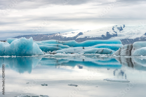Jökulsárlón glacier lagoon with refelctions of a ice rock in the water an the glacier in the background of the jökulsarlon
