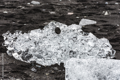 Jökulsárlón glacier lagoon with ice rocks in the water and beach, jökulsarlon photo