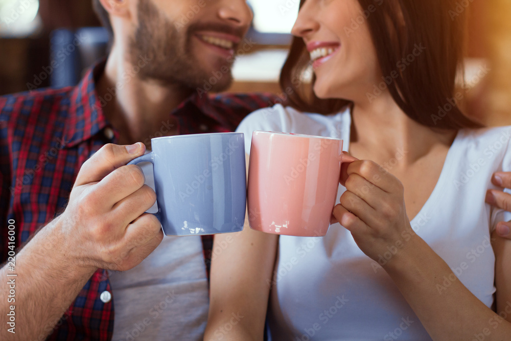 happy young couple relax at modern home living room indoor. Couple in love - Beginning of a Love Story happy young couple relax at modern home living room indoor. Couple in love - Beginning of a Love Story