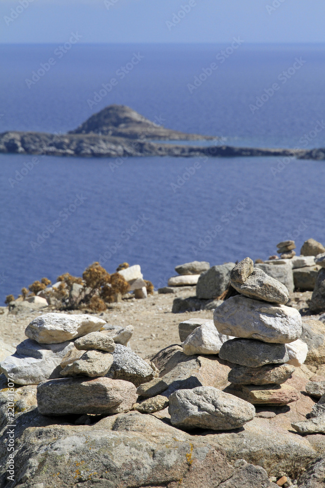 Balance and Tranquility - stacked stones in Mykonos, Greece Balance and Tranquility - stacked stones in Mykonos, Greece
