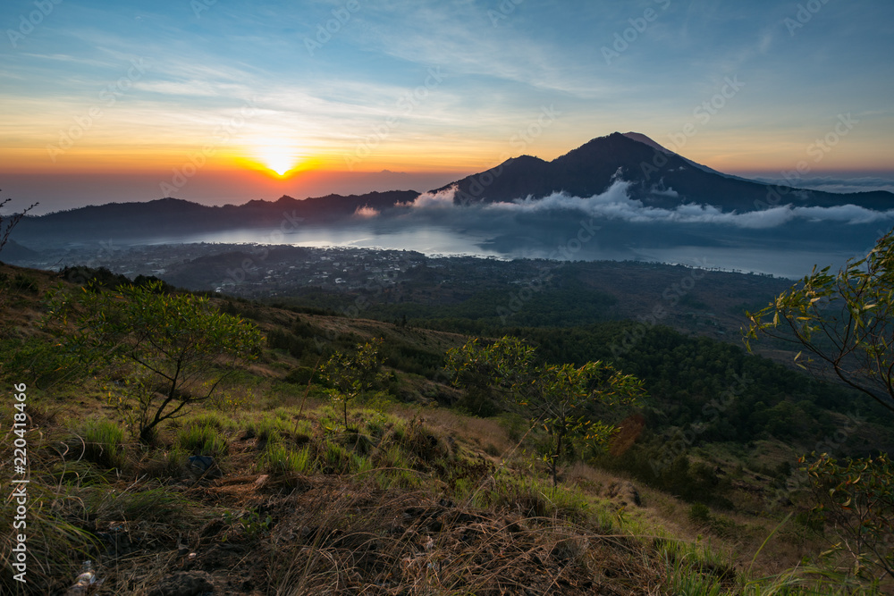 Sunrise from gunung batur with view to gunung agung mountain in bali indonesia