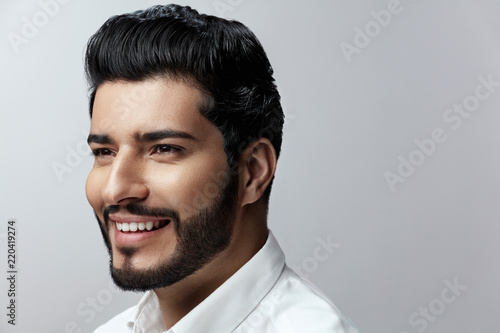 Fototapeta Hair And Beard. Beautiful Smiling Man With Hair Style