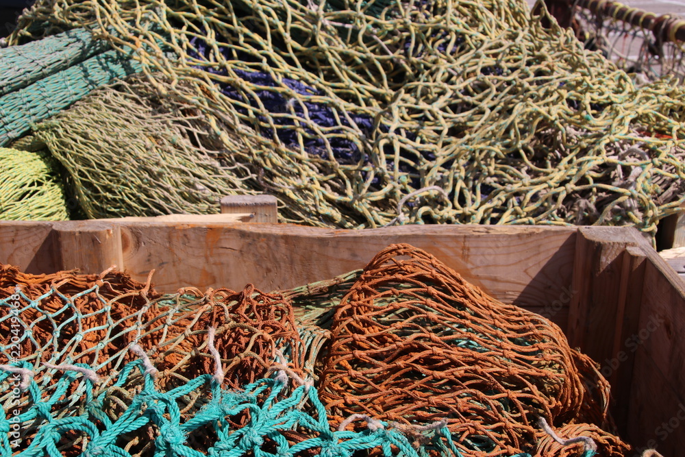 Fisherman's net are drying on the quay in the harbor of Urk in Netherlands.