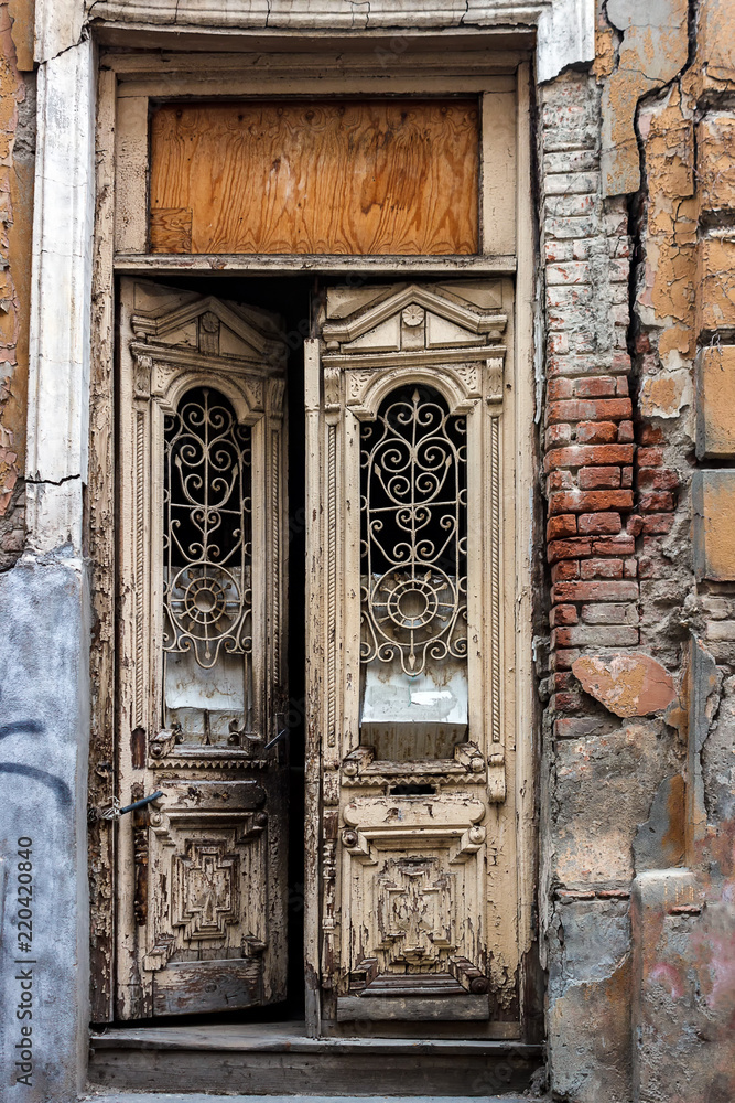 the wooden door of the old collapsing house the wooden door of the old collapsing house