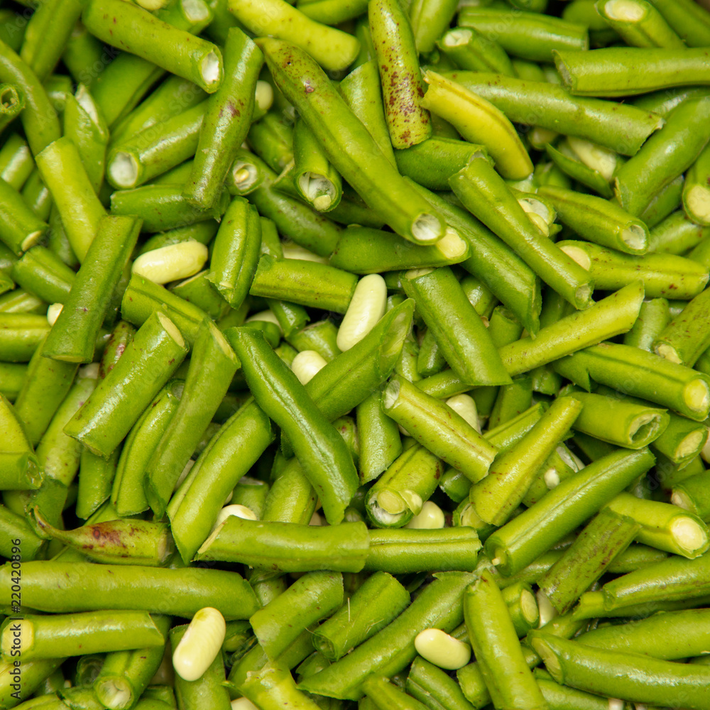 Harvest of green beans from the garden as a background