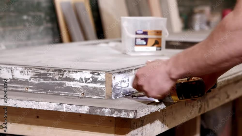 Drilling the side of a concrete worktop in 4K 60FPS Drilling the side of a concrete worktop in 4K 60FPS