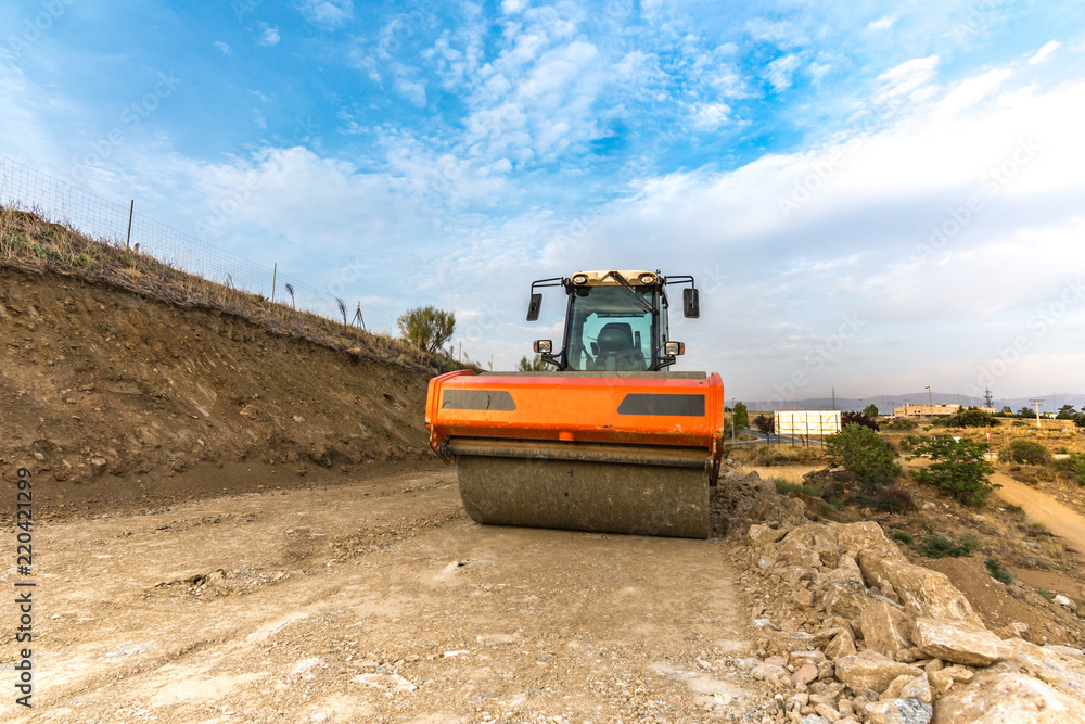 Steamroller performing work prior to the asphalting of a road Steamroller performing work prior to the asphalting of a road