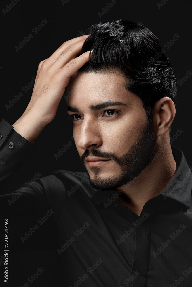 Men Hair Beauty. Handsome Male Model Touching Healthy Hair 