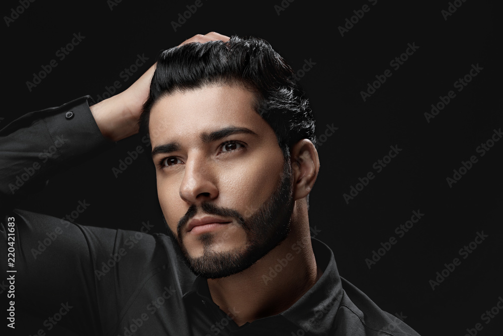 Men Hair Care. Man With Beard, Beauty Face Touching Black Hair Men Hair Care. Man With Beard, Beauty Face Touching Black Hair