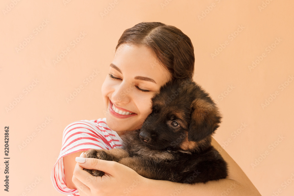 Beautiful girl hugging tight her cute small puppy Beautiful girl hugging tight her cute small puppy