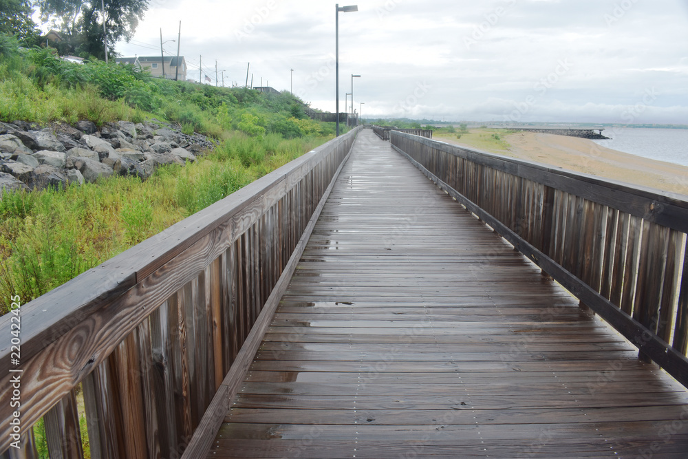 Wet boardwalk after a rain storm at the beach