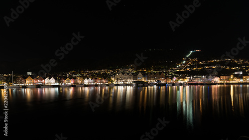 Bergen norway brygge by night with reflection in the water, norway, europe © chrislhasl