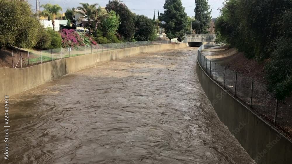 After a rainstorm, flood waters surge into the drainage system of the LA River. After a rainstorm, flood waters surge into the drainage system of the LA River.