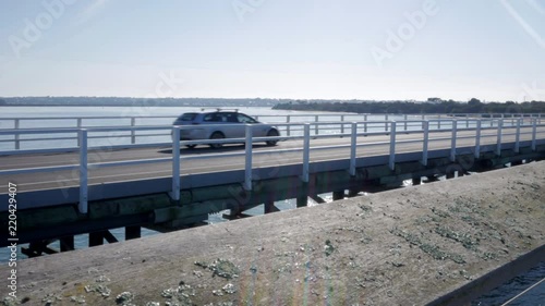 Barwon Heads bridge and footbridge. Beautiful sunny day, cars traveling over bridge. photo