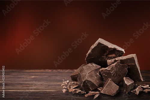 Close-up broken chocolate bar isolated on white background