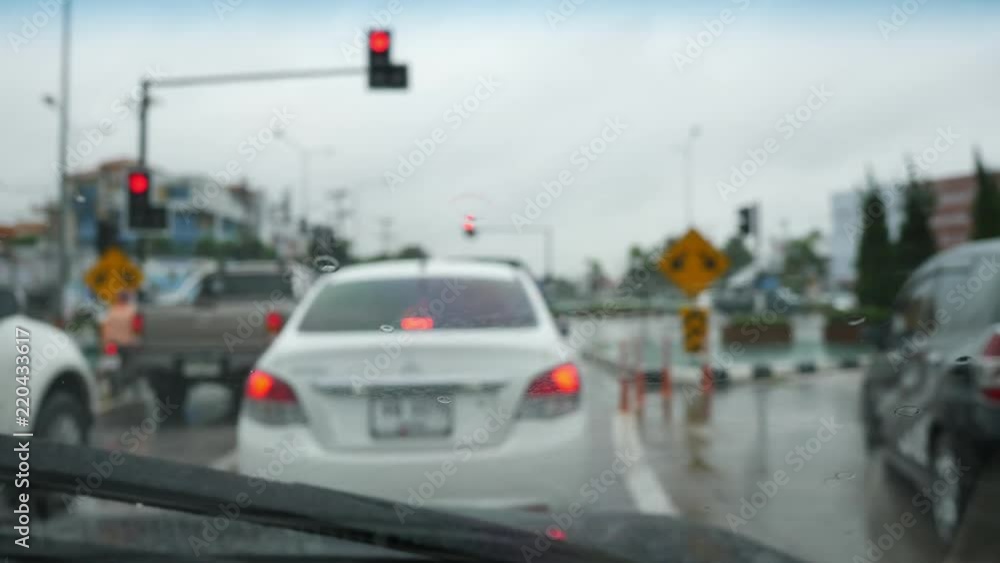 traffic jam in rainy day, slow motion wiper swing clearing rain on windshield traffic jam in rainy day, slow motion wiper swing clearing rain on windshield