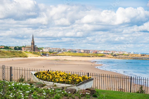 Ornamental Boat containing Flowers, with Tynemouth's Coastline in the background photo