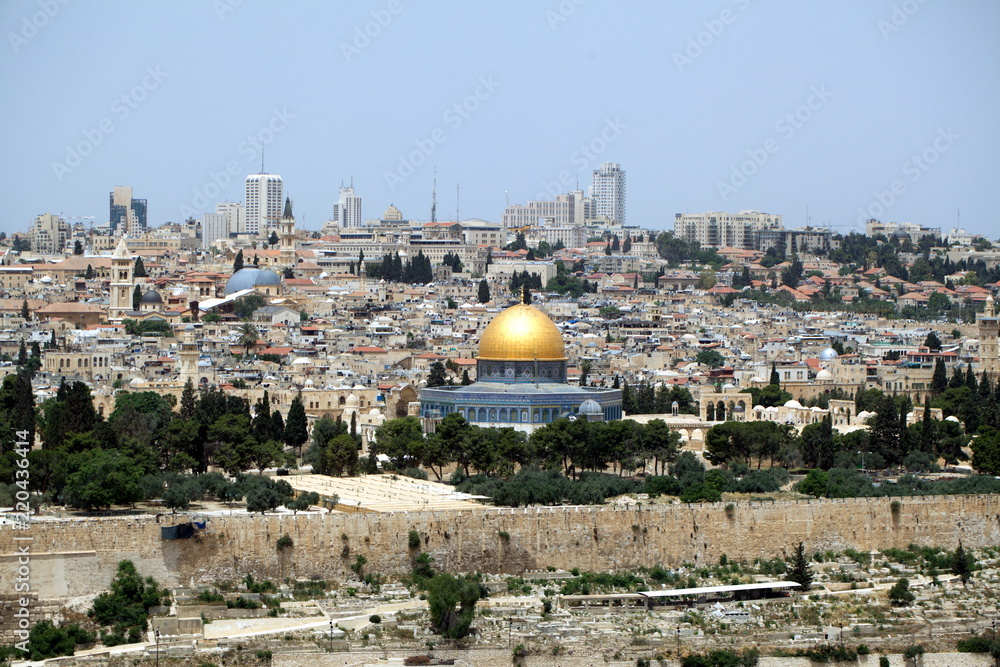 view of the old city of Jerusalem in Israel with an olive mountain. the golden dome of the Moslem mosque