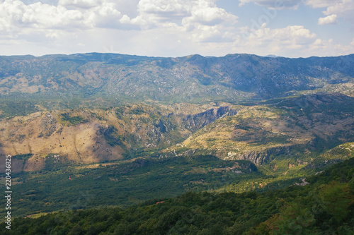 Mountain summer landscape. Montenegro, Dinaric Alps, view of Bjelopavlici plain near Ostrog monastery