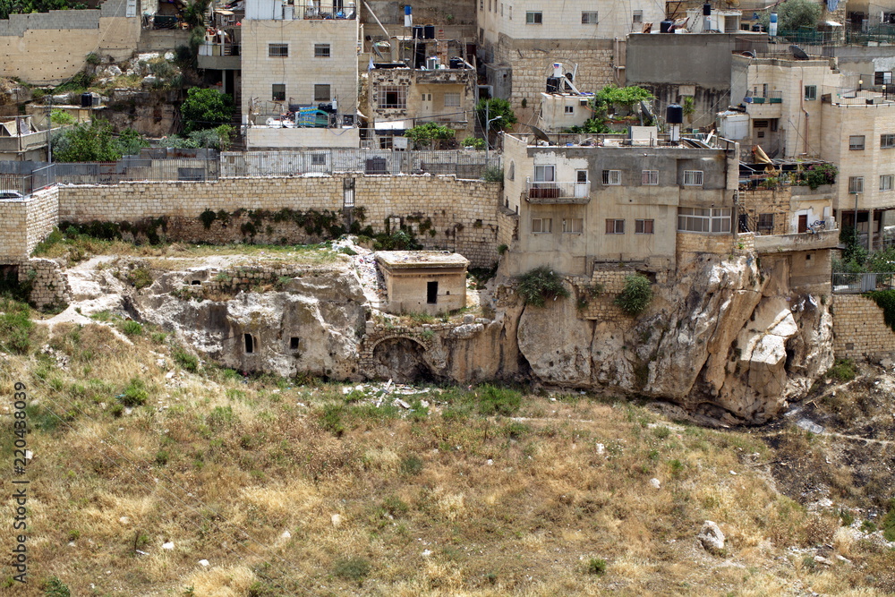 landscape of the old city of Jerusalem with houses on the mountain
