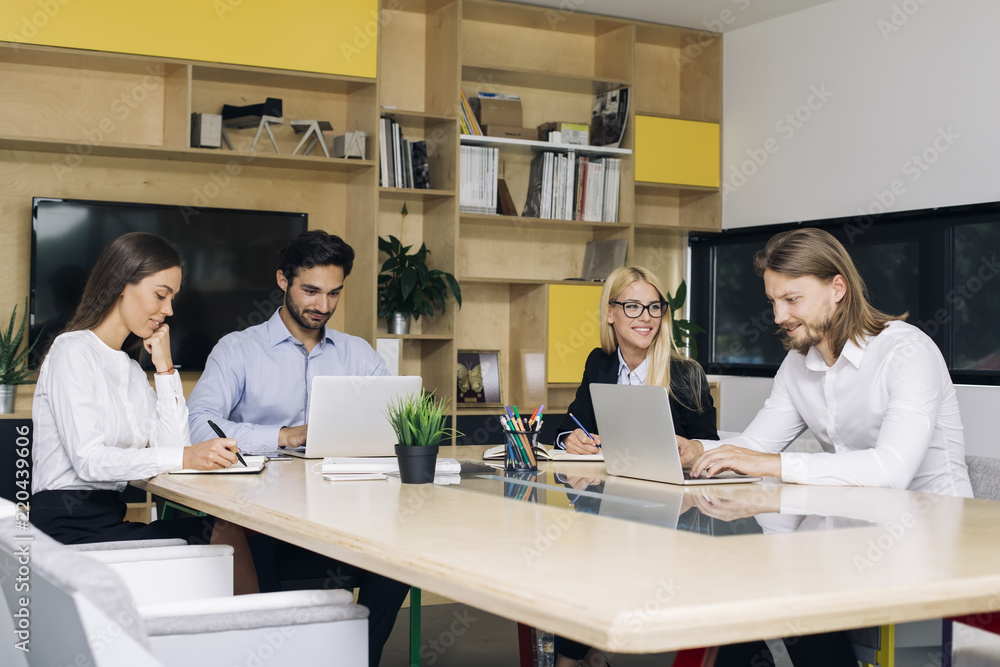 Young busimesspeople working in modern office Young busimesspeople working in modern office